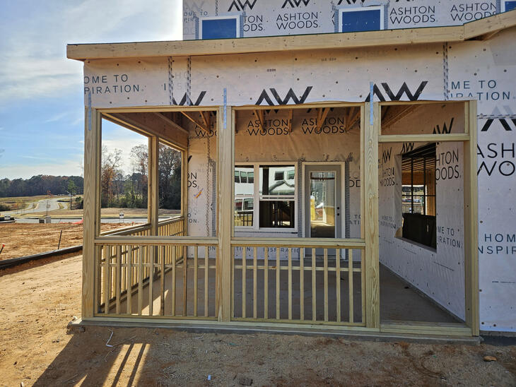 Wood-framed screen porch under construction attached to a residential home. Call or text Raleigh Outdoor Spaces for a free consultation.